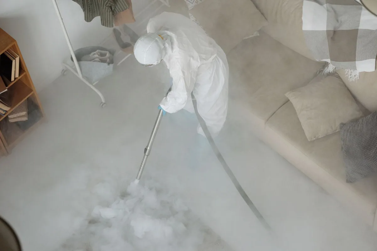 Biohazard cleanup technician in protective equipment, Prudenville, MI